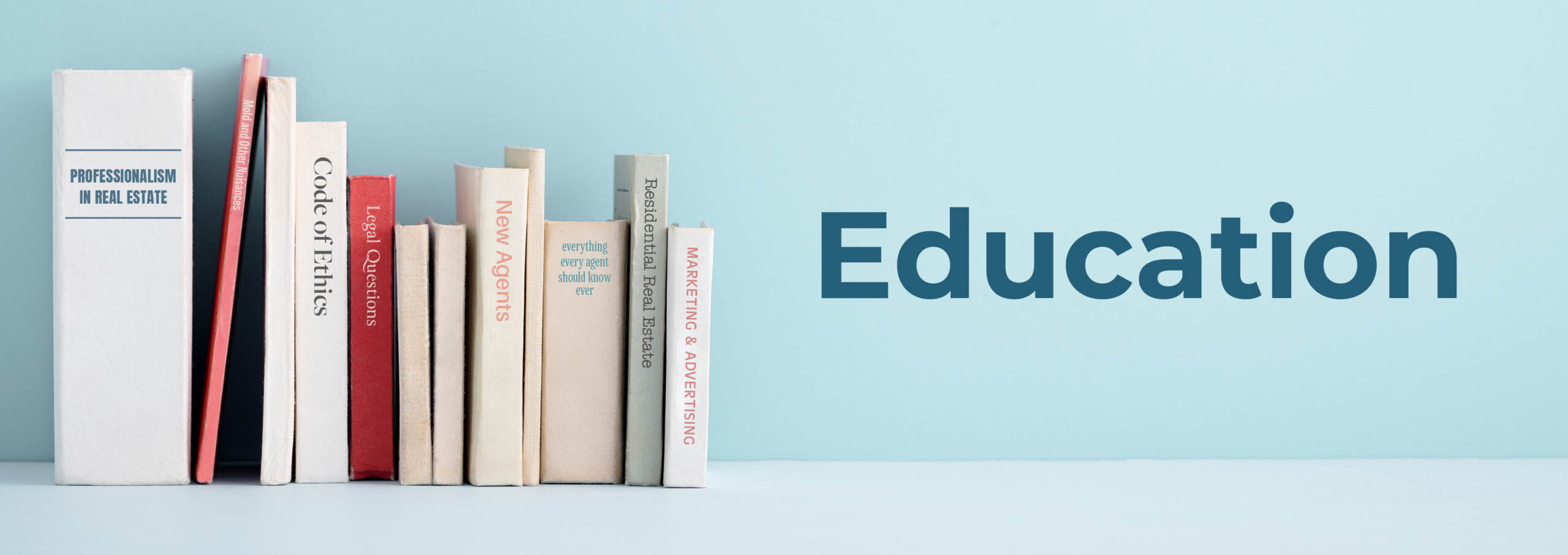 Image of row of books with spines showing titles of Real Estate Education topics with "Education" title overlaid